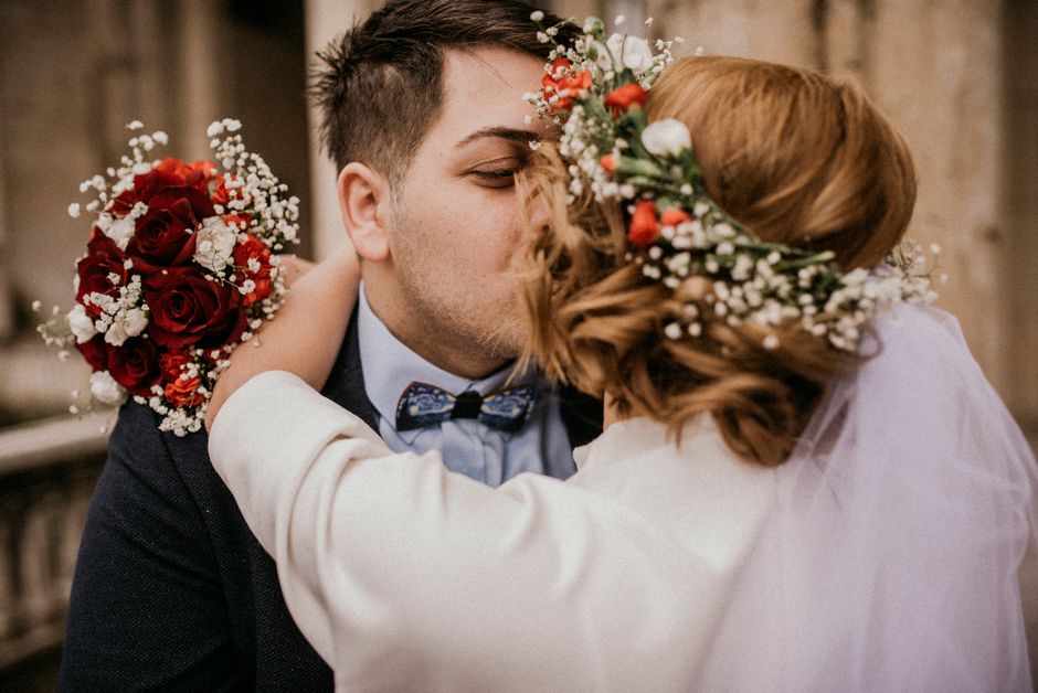 Couple kissing during wedding ceremony